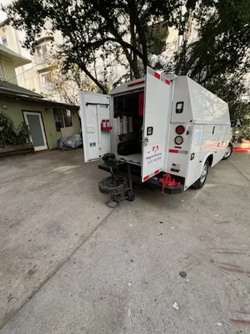 Magnet Plumbing service vehicle on-site for Grease Trap Cleaning in Mission Bay